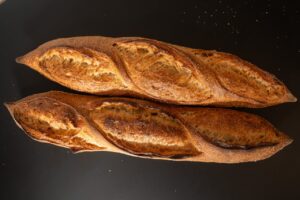 Freshly baked artisan baguettes with a crispy crust in Berlin, Germany.
